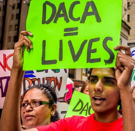 DACA Protester holding sign